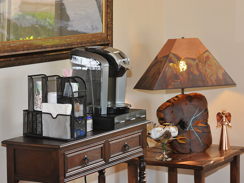 table in lobby with coffee machine on it